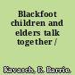 Blackfoot children and elders talk together /